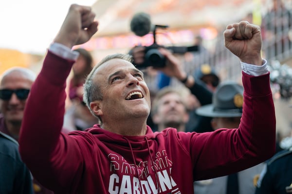 South Carolina head coach Shane Beamer celebrates after defeating Clemson in an NCAA college football game Saturday, Nov. 30, 2024, in Clemson, S.C. (AP Photo/Jacob Kupferman)