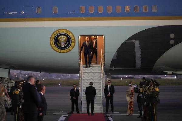 President Joe Biden walks from Air Force One as he arrives at Quatro de Fevereiro international airport in the capital Luanda, Angola on Monday, Dec. 2, 2024, on his long-promised visit to Africa. (AP Photo/Ben Curtis)