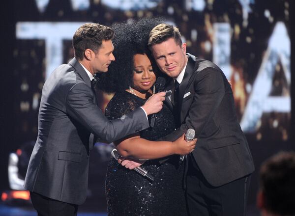 HOLLYWOOD, CA - APRIL 7: Judge Ryan Seacrest (L) announces American Idol Season 15 winner Trent Harmon (R) with runner-up La'Porsha Renae, onstage at FOX's American Idol Season 15 Finale on April 7, 2016 at the Dolby Theatre in Hollywood, California. (Photo by FOX via Getty Images) *** Local Caption *** Ryan Seacrest; La'Porsha Renae; Trent Harmon