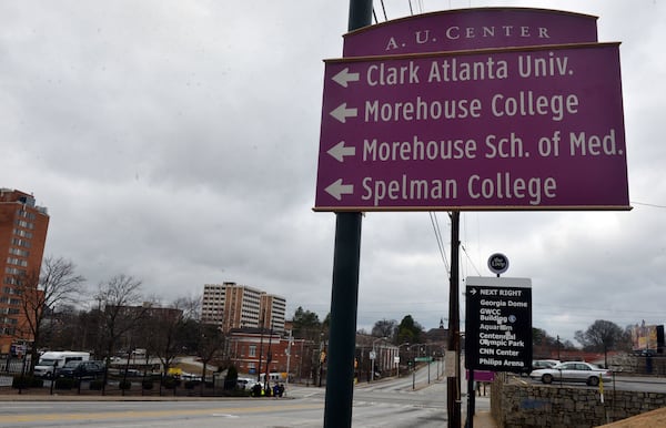 Signs point to the Atlanta University Center area along Martin Luther King Jr Drive before Northside Drive. 