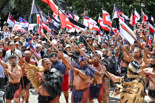 Indigenous Māori people protest outside Parliament against a proposed law that would redefine the country's founding agreement between Indigenous Māori and the British Crown, in Wellington, New Zealand, Tuesday, Nov. 19, 2024. (AP Photo/Mark Tantrum)