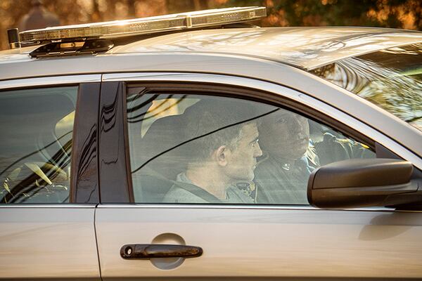 Fotis Dulos leaves his home in the passenger seat of a State Police patrol car after being arrested at his home in Farmington, Conn.