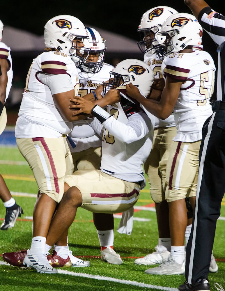 Members of the Pebblebrook offense help Qamar Grant, quarterback for Pebblebrook, up after being sacked during the Harrison vs. Pebblebrook high school football game on Friday, September 23, 2022, at Harrison high school in Kennesaw, Georgia. Pebblebrook defeated Harrison 31-14. CHRISTINA MATACOTTA FOR THE ATLANTA JOURNAL-CONSTITUTION.