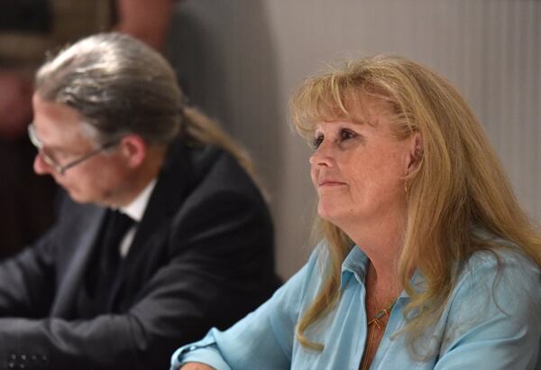 Mayor Theresa Kenerly reacts during public hearing and regular meeting at Hoschton Train Depot in Hoschton on May 30, 2019. Mayor Theresa Kenerly and Councilman Jim Cleveland have been under fire for racist comments regarding the handling of a black candidate for city administrator in March. The two politicians are now the target of a recall effort. HYOSUB SHIN / HSHIN@AJC.COM