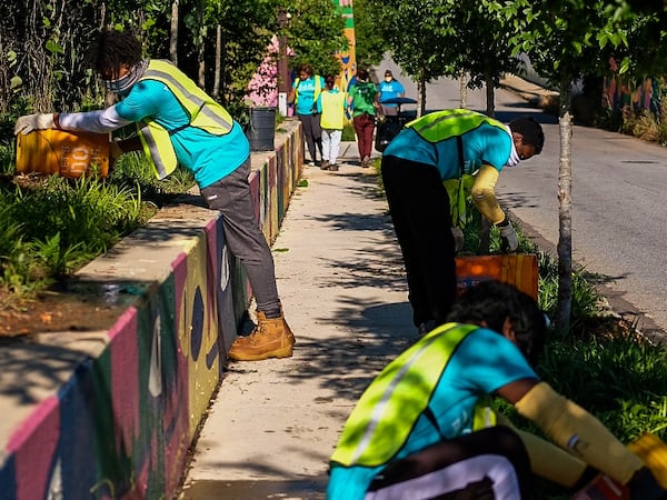 Youth Tree Team summer job trainees water trees planted by Trees Atlanta in the Reynoldstown neighborhood near the Atlanta BeltLine.