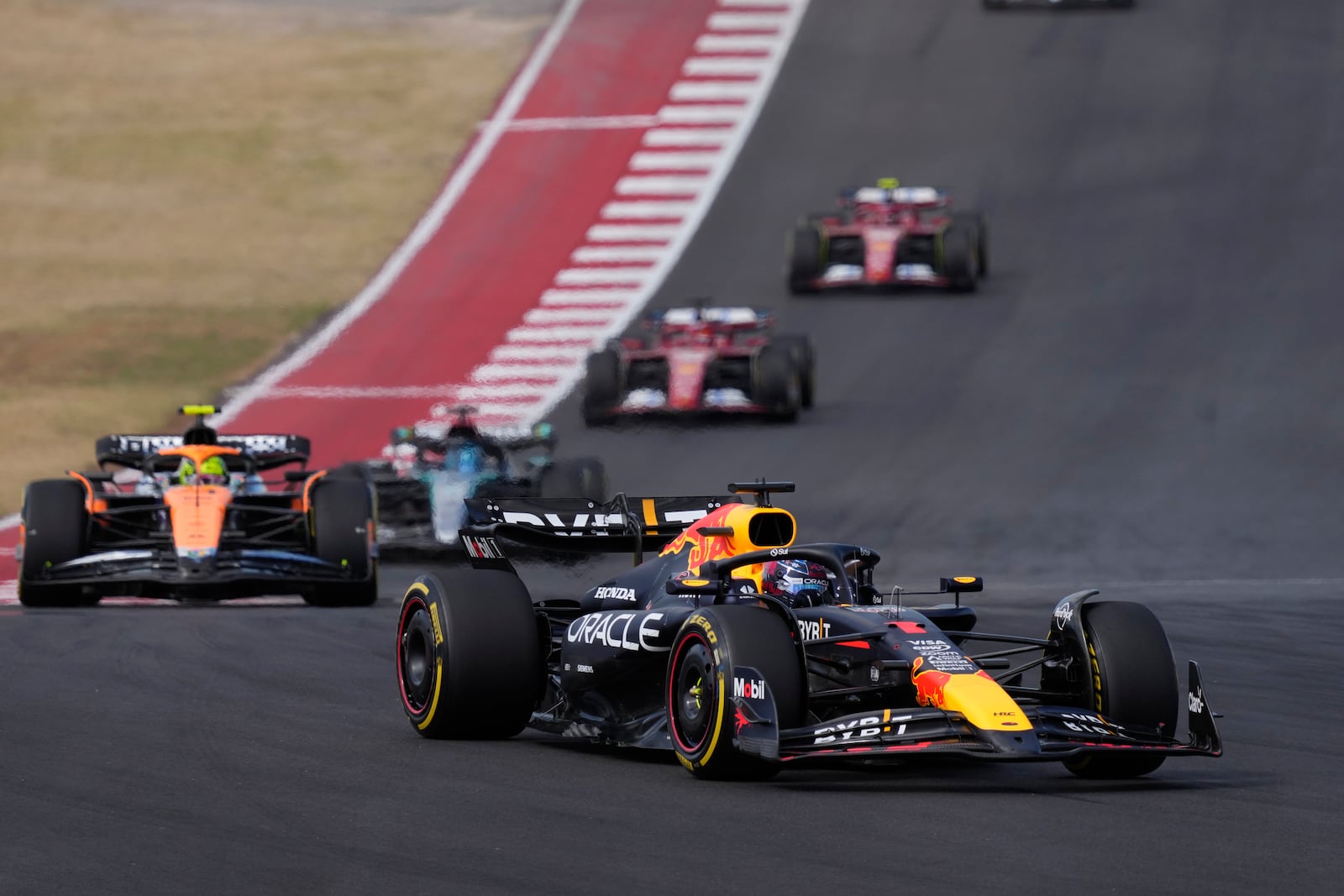 Red Bull driver Max Verstappen, of the Netherlands, steers into a turn during a sprint race ahead of the Formula One U.S. Grand Prix auto race at Circuit of the Americas, Saturday, Oct. 19, 2024, in Austin, Texas. (AP Photo/Eric Gay)