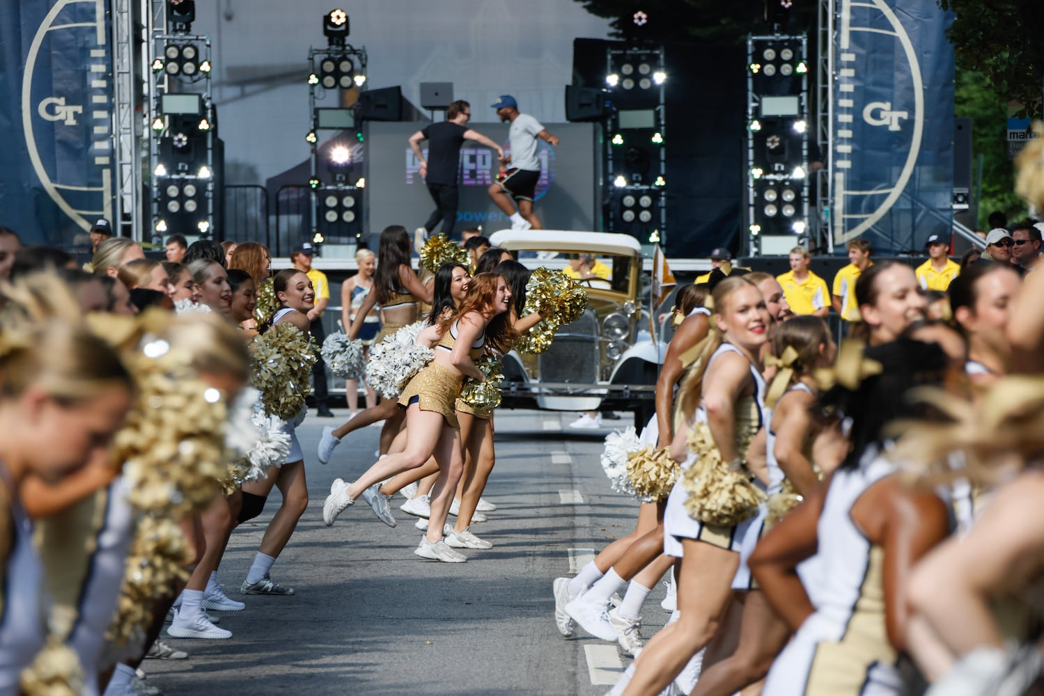 Georgia Tech cheerleaders entertain the crowd before the team arrives.   (Bob Andres for the Atlanta Journal Constitution)