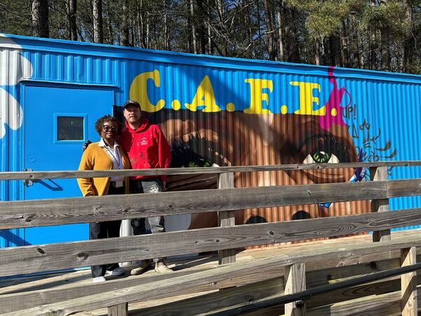 Justine Robinson and Chastain Clark outside the Dunaire C.A.F. E. where families may receive food and clothing along with resources for health and employment. A coalition of donors helped make the resource center,  the first of its kind in DeKalb schools, a reality. Nedra Rhone/nrhone@ajc.com