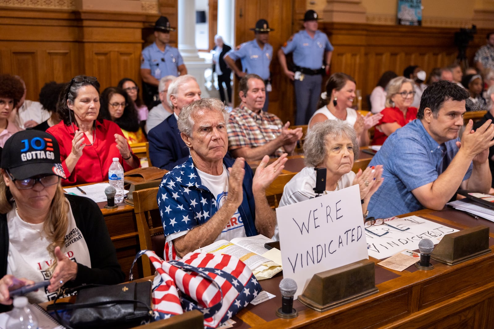 Election skeptics clap during public comment at a July meeting of the State Election Board at the Capitol in Atlanta. (Arvin Temkar/AJC)