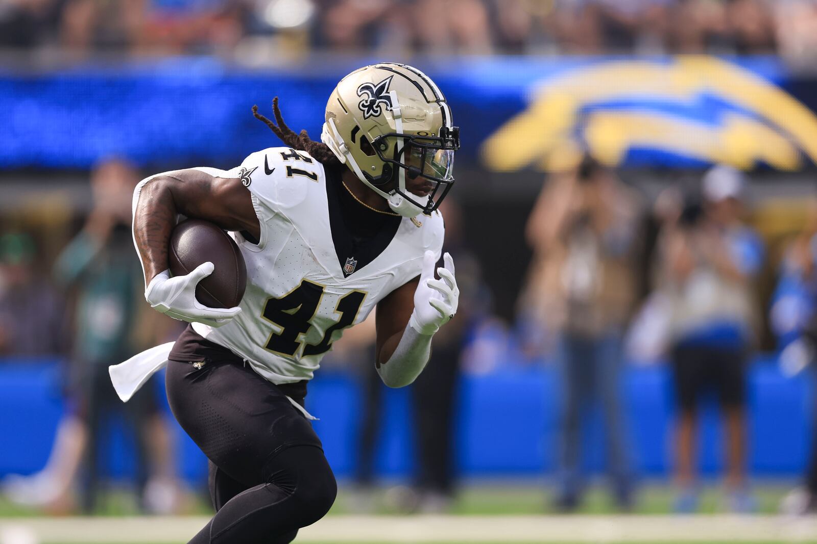 New Orleans Saints running back Alvin Kamara (41) carries in the first half of an NFL football game against the Los Angeles Chargers in Inglewood, Calif., Sunday, Oct. 27, 2024. (AP Photo/Ryan Sun)