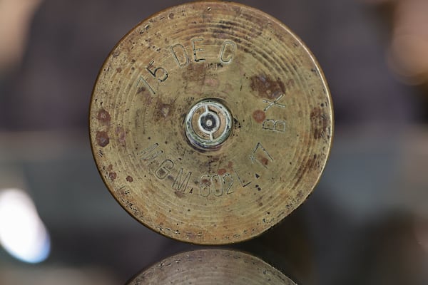 Views of the bottom of 75 mm howitzer shell casing found by World War II veteran and liberator Hilbert “Hibby” Margot when he was a soldier on Wednesday, Jan. 17, 2024.  (Natrice Miller/ Natrice.miller@ajc.com)