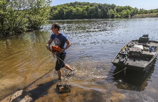 Mike Sauer spent a day enjoying the peace and quiet of Stone Mountain Lake on Tuesday.  JOHN SPINK / JSPINK@AJC.COM