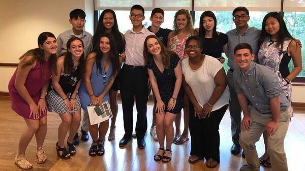 Joey Ye (in the white shirt and black pants) takes a group picture during the first-year student orientation at Emory University in 2017. Ye has been taking courses remotely from China, where he was born and raised, since the coronavirus pandemic took hold in Georgia in March 2020. He became friends with Zariah Jenkins, standing in the front row, second from the right. (Courtesy of Zariah Jenkins)