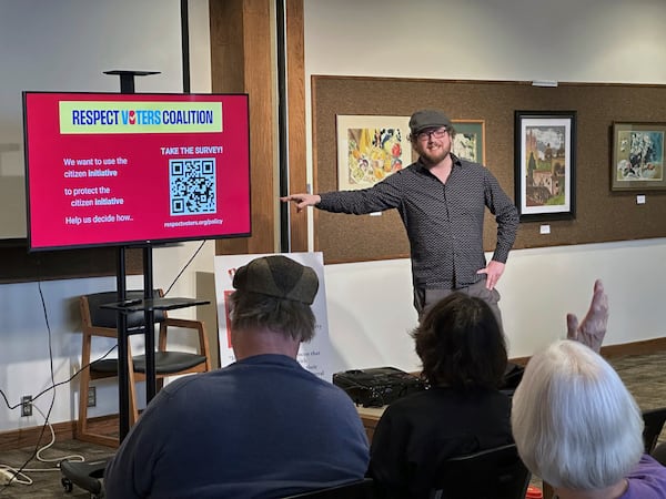 Organizer Garrett Finazzo explains how people can become involved in the Respect Voters Coalition during a town-hall forum at the Missouri River Regional Library in Jefferson City on Saturday, March 15, 2025. (AP Photo/David A. Lieb)