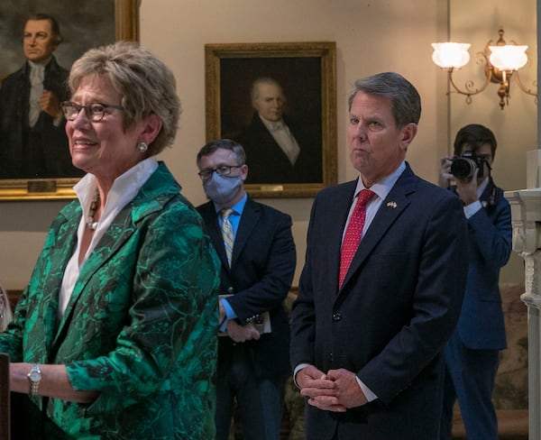 Gov. Brian Kemp, right, listens as Georgia Department of Public Health Commissioner Kathleen Toomey speaks during a COVID-19 update press conference at the Georgia Capitol Building in Atlanta on Aug. 30, 2021. (Alyssa Pointer/Atlanta Journal Constitution)