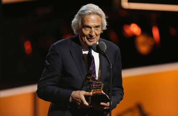 John McLaughlin accepts the best improvised jazz solo award for "Miles Beyond" at the 60th annual Grammy Awards at Madison Square Garden on Sunday, Jan. 28, 2018, in New York. (Photo by Matt Sayles/Invision/AP)