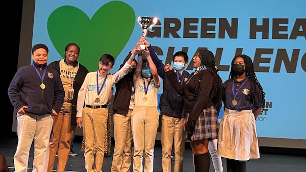 Students from Elite Scholars Academy celebrate their award in a competition where the teams discussed how they will try to create change to improve the environment. (Photo Credit: Captain Planet Foundation.)