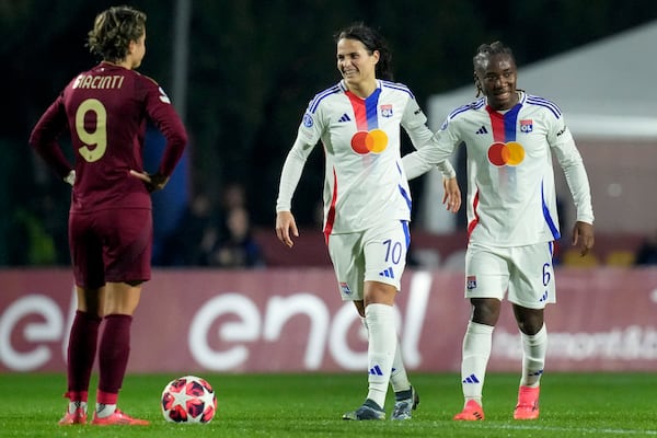 Olympique Lyonnais' Melchie Dumornay, right, celebrates after scoring her side's second goal during the women's Champions League soccer match between AS Roma and Olympique Lyon in Rome, Italy, Wednesday, Nov. 13, 2024 (Photo by Alfredo Falcone/LaPresse via AP)