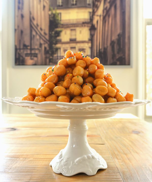 Purcidduzzi (fried cookies made with olive-oil dough) can serve as a holiday centerpiece. STYLING BY CATERINA SCARANO / CONTRIBUTED BY CHRIS HUNT PHOTOGRAPHY