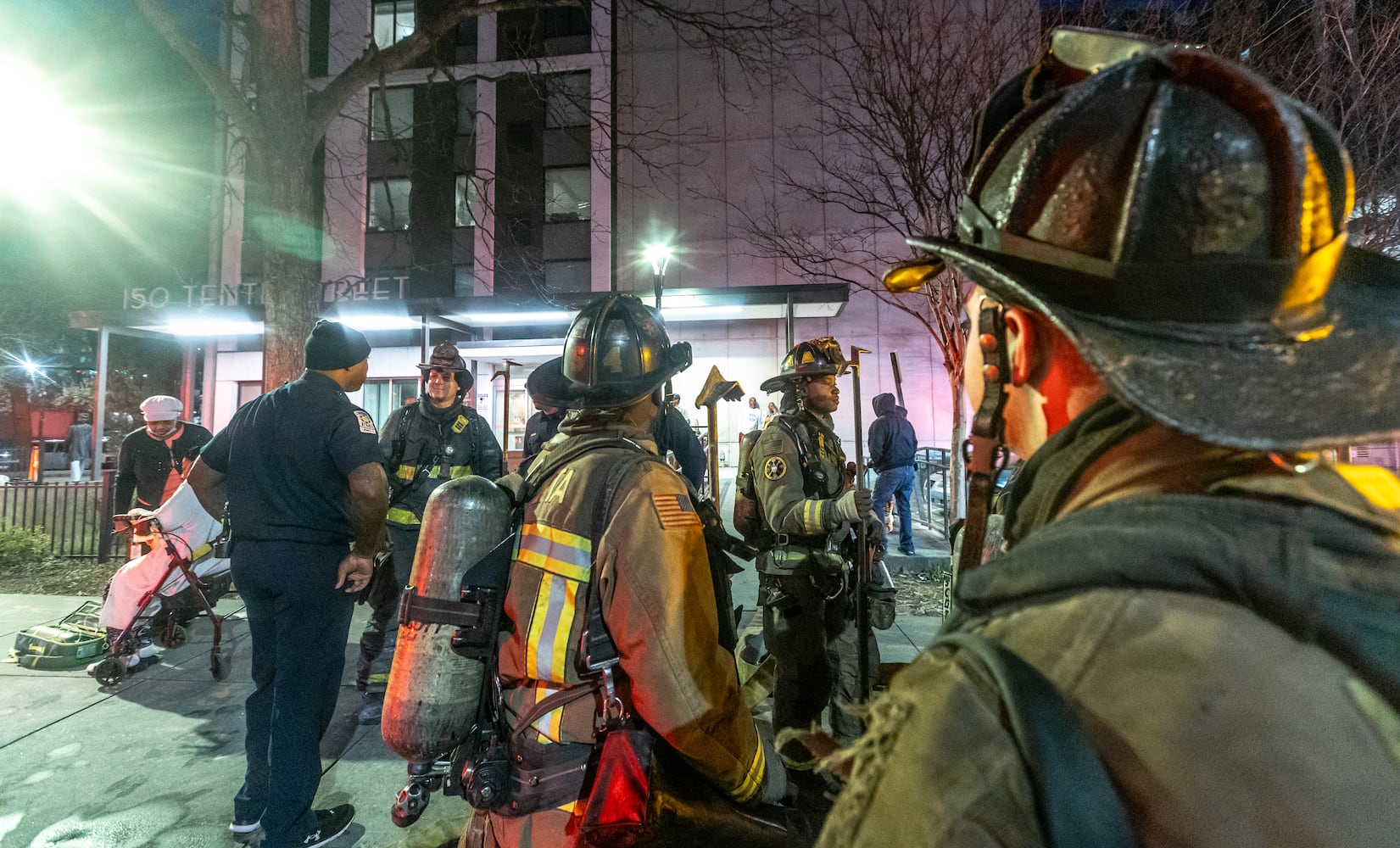 A fire in a trash chute of a Midtown Atlanta high-rise for seniors prompted the evacuation of its lower floors Wednesday, March 13, 2024. Atlanta fire Battalion Chief Michael Roman said crews were called to the 10th & Juniper building near Piedmont Park around 6:30 a.m. and found smoke on the fourth floor coming from the trash chute. Firefighters then went into the basement and found an active fire in the trash compactor, he said. Additional units were called, and the fire was quickly extinguished. About 30 to 40 residents were evacuated from the lower half of the building on floors that had light smoke, Roman said. The smoke was quickly ventilated out. Only one resident was treated on scene for smoke inhalation, Roman said. (John Spink / John.Spink@ajc.com)