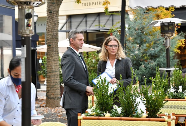 Ilona Knopfler, right, confers with Chad Goughnour, service director, at Le Bilboquet, where she works as a consultant, in Buckhead. Knopfler says, “When you love your job, you do it 100%. And then you wake up and seven years have gone by and you haven’t seen much of your family and you have turned down all the invitations to see your friends.” (Hyosub Shin / Hyosub.Shin@ajc.com)