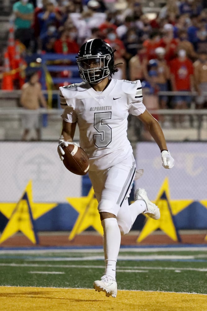 Alpharetta wide receiver Jaden Slocum (5) runs into the end zone for a touchdown after a long catch in the second half against Chattahoochee at Chattahoochee high school Friday, September 25, 2020 in Johns Creek, Ga.. Alpharetta won 21-7. JASON GETZ FOR THE ATLANTA JOURNAL-CONSTITUTION