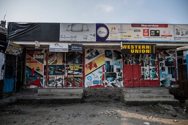 Shops are closed in downtown Goma, Democratic Republic of Congo, Thursday, Feb. 27, 2025, one month after Rwanda-backed M23 rebels captured the city. (AP Photo/Moses Sawasawa)