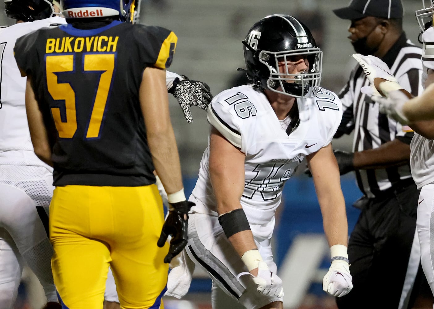 Alpharetta linebacker Caleb Moran (16) celebrates a tackle in the second half against Chattahoochee at Chattahoochee high school Friday, September 25, 2020 in Johns Creek, Ga.. Alpharetta won 21-7. JASON GETZ FOR THE ATLANTA JOURNAL-CONSTITUTION