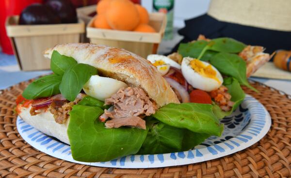 Pan Bagnat, a Provencal-style tuna sandwich, can be made on a ciabatta loaf or individual rolls. (Styling by Lisa Hanson / Chris Hunt for the AJC)