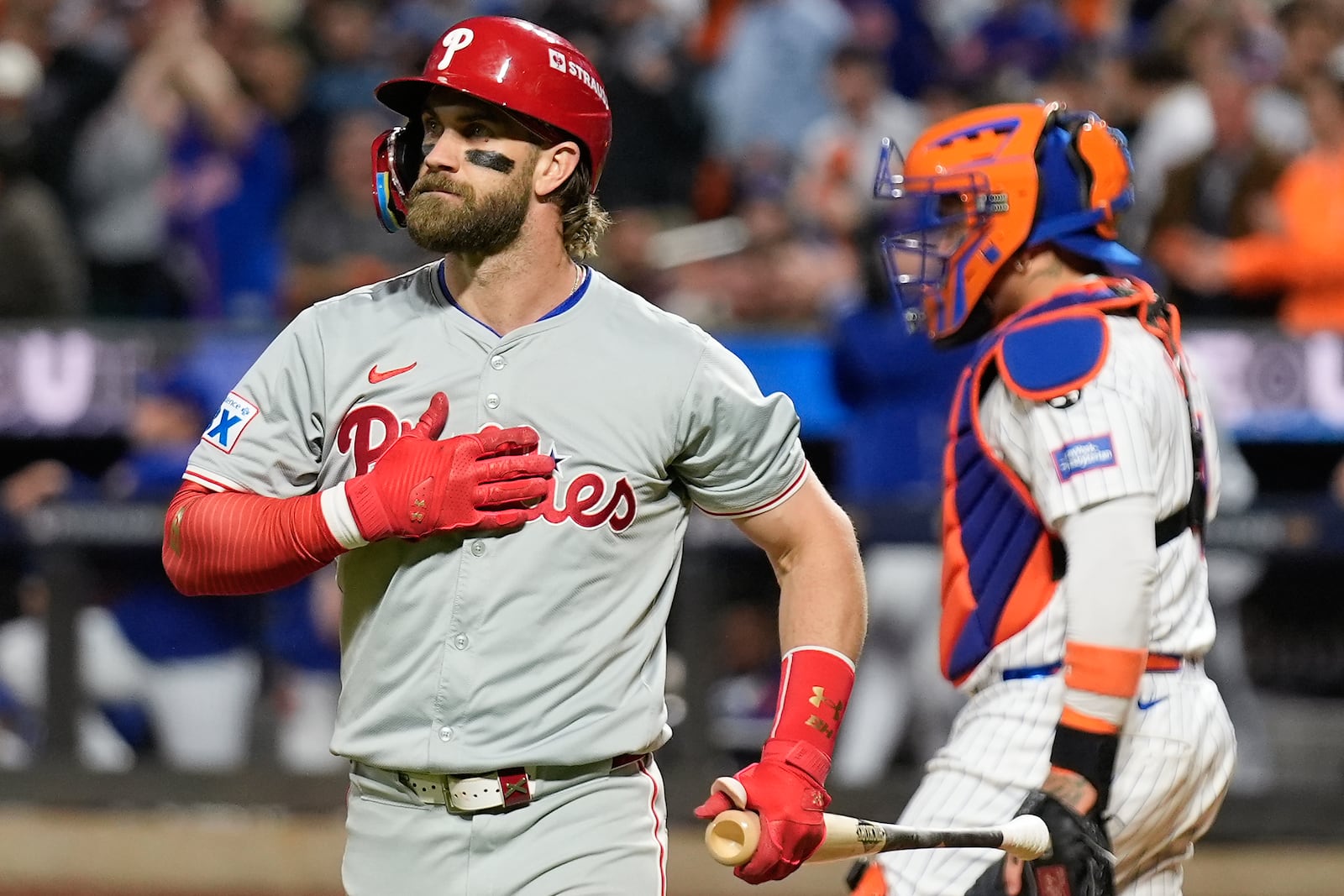 Philadelphia Phillies' Bryce Harper (3) reacts after striking out against the New York Mets during the sixth inning of Game 3 of the National League baseball playoff series, Tuesday, Oct. 8, 2024, in New York. (AP Photo/Seth Wenig)