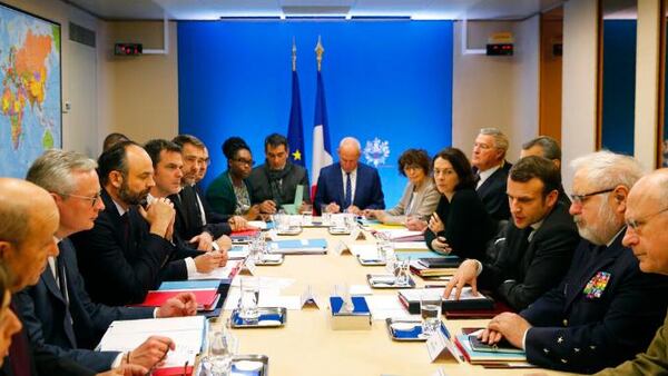 French President Emmanuel Macron, third right, chairs a meeting concerning the COVID-19 situation in France, Saturday, Feb. 29, 2020 in Paris.