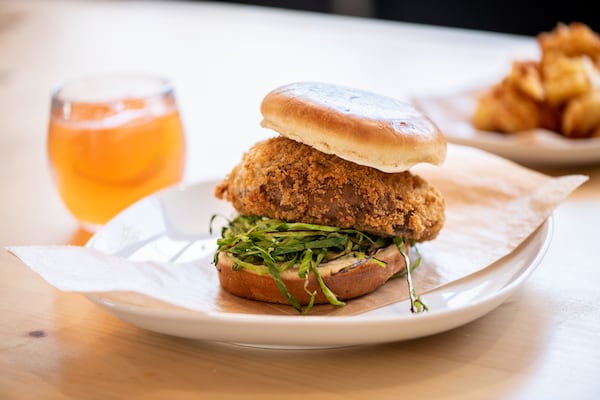 The Abby Singer Portobello Burger: a marinated and fried mushroom cap, shredded cabbage, and garlic aioli. (Mia Yakel for The Atlanta Journal-Constitution)