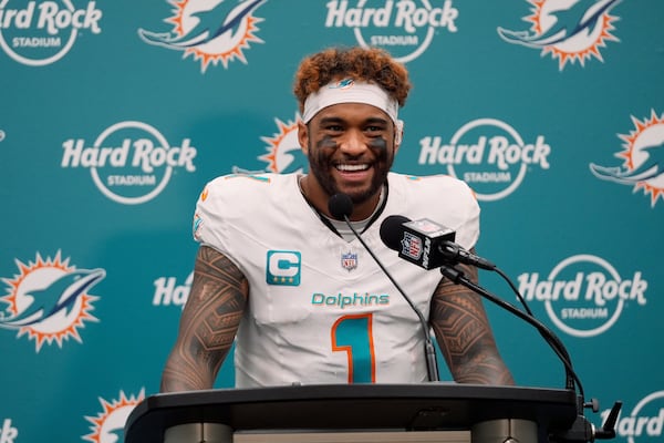 Miami Dolphins quarterback Tua Tagovailoa (1) speaks during a news conference following an NFL football game against the New York Jets, Sunday, Dec. 8, 2024, in Miami Gardens, Fla. (AP Photo/Wilfredo Lee)