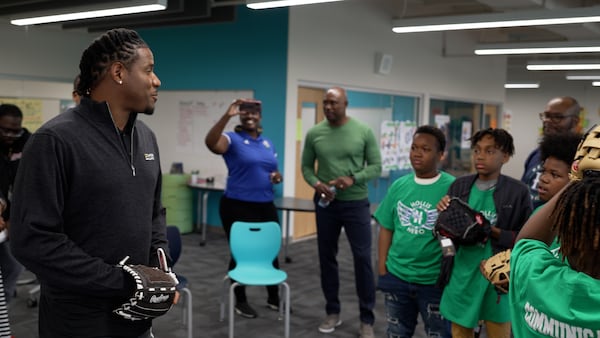 Former Major League pitcher Edwin Jackson tutors kids in the L.E.A.D. program. Jackson's Players Alliance recently donated $150,000 to the program