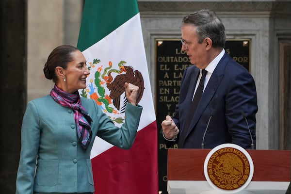 FILE - Mexican President Claudia Sheinbaum, left, and Economy Minister Marcelo Ebrard attend a news conference at the National Palace in Mexico City, Oct. 15, 2024. (AP Photo/Fernando Llano, File)