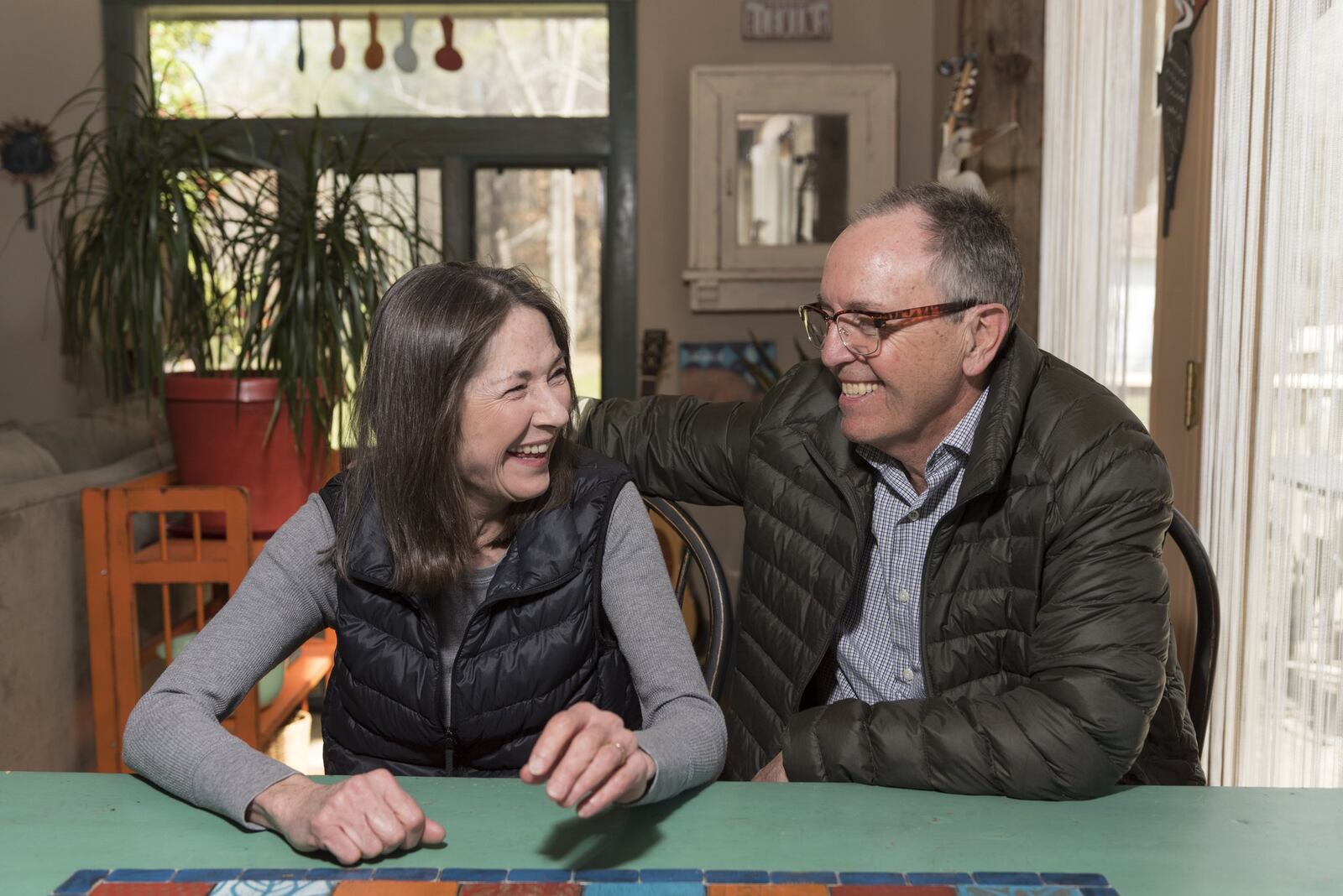 March 10, 2017, Tunnel Hill - Joel Blevins, right, and his wife Katie Blevins, left, pose for a portrait in their home in Tunnel Hill, Georgia, on Friday, March 10, 2017. After not having health insurance for 3 years, the Blevins were able to be insured under the Affordable Care Act. The current administration is working towards repealing and replacing the law, which would greatly impact them. “It’s terrifying not to have insurance,” says Katie. “In our community I meet people that just don’t have any insurance…I worry about them. I worry about their kids and their family members,” says Joel. Katie works as a freelance artist and Joel works as a carpenter, and they rely on the ACA subsidy to be able to afford health insurance. “If we were to lose the subsidy, we’re looking at losing our health insurance,” says Joel. (DAVID BARNES / SPECIAL)