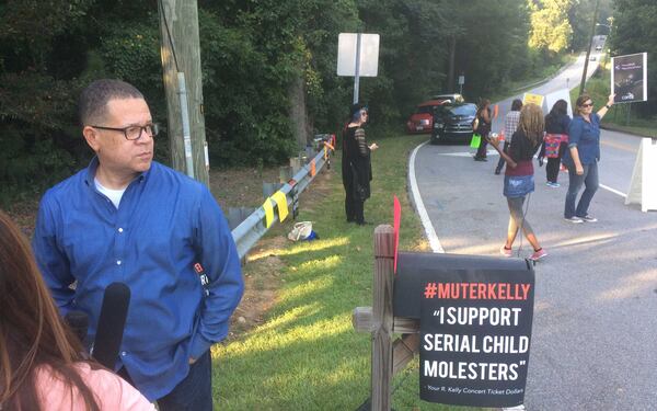 Former Fulton County Chairman, and now Atlanta mayoral candidate, John Eaves speaks with media outside R. Kelly's Atlanta concert at the Wolf Creek Amphitheater on Friday, Aug. 25, 2017.