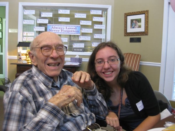 William D. King and granddaughter Olivia enjoy a bluegrass gospel concert at his assisted living home. (Courtesy of the King family)