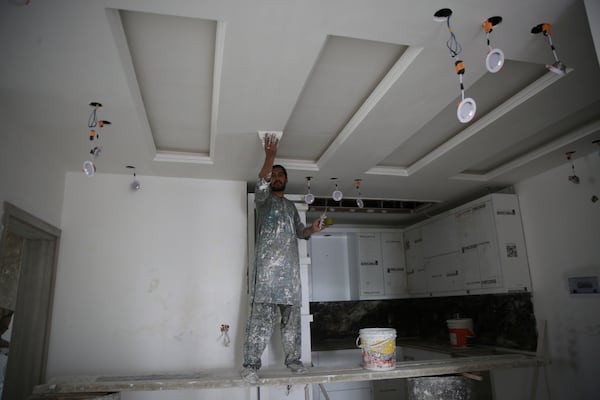 A man works inside a luxury house in the city of Kabul, Afghanistan, Sept. 23, 2024. (AP Photo/Siddiqullah Alizai)