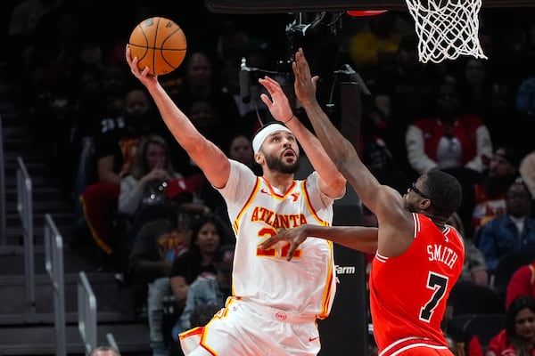 Atlanta Hawks forward Larry Nance Jr. (22) takes a shot as Chicago Bulls forward Jalen Smith (7) defends during the first half of an NBA basketball game Saturday, Nov. 9, 2024, in Atlanta. (AP Photo/ John Bazemore)