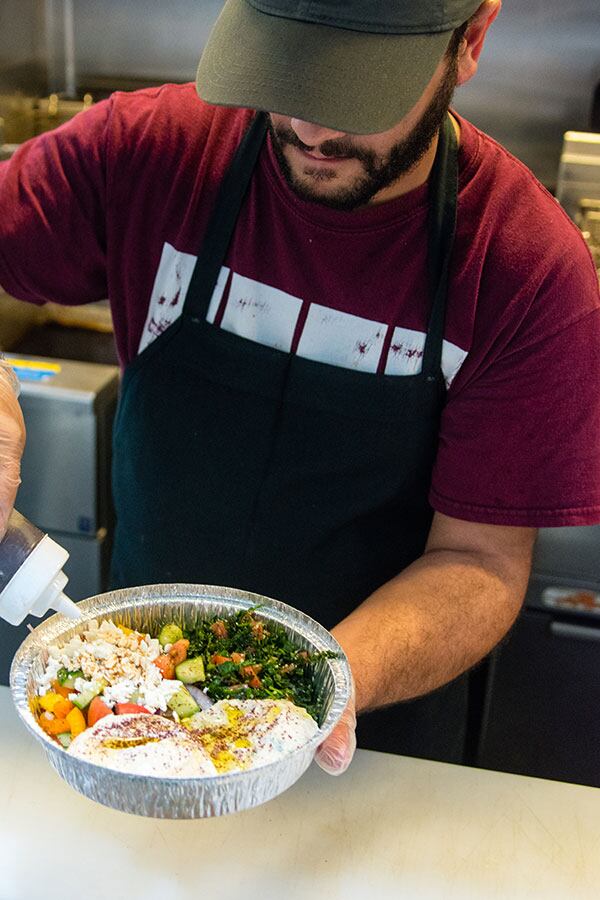 Mohamad Gehad Aldarra prepares a Veggie Feast. CONTRIBUTED BY HENRI HOLLIS