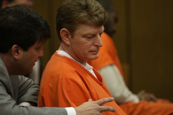 Dennis Allaben, right, with his lawyer Steven Frey at a 2010 probable cause hearing. VINO WONG/AJC