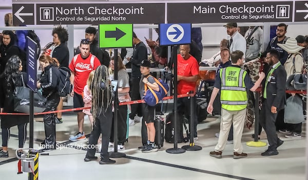 Passengers waited in lines for security at Hartsfield-Jackson International Airport on Monday, October 9, 2023. Credit: John Spink / jspink@ajc.com