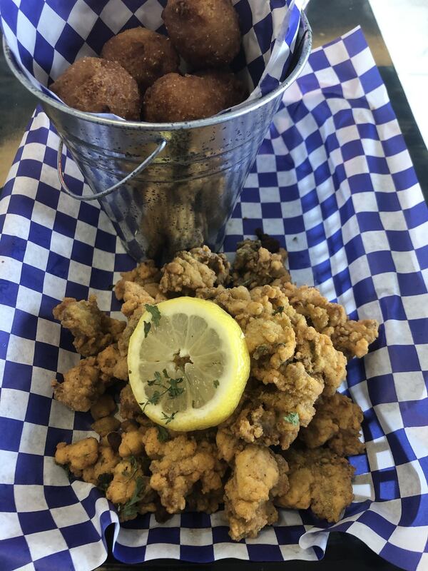 The fried shrimp basket with hush puppies at Trederick’s Seafood & Grill downtown. CONTRIBUTED BY WENDELL BROCK