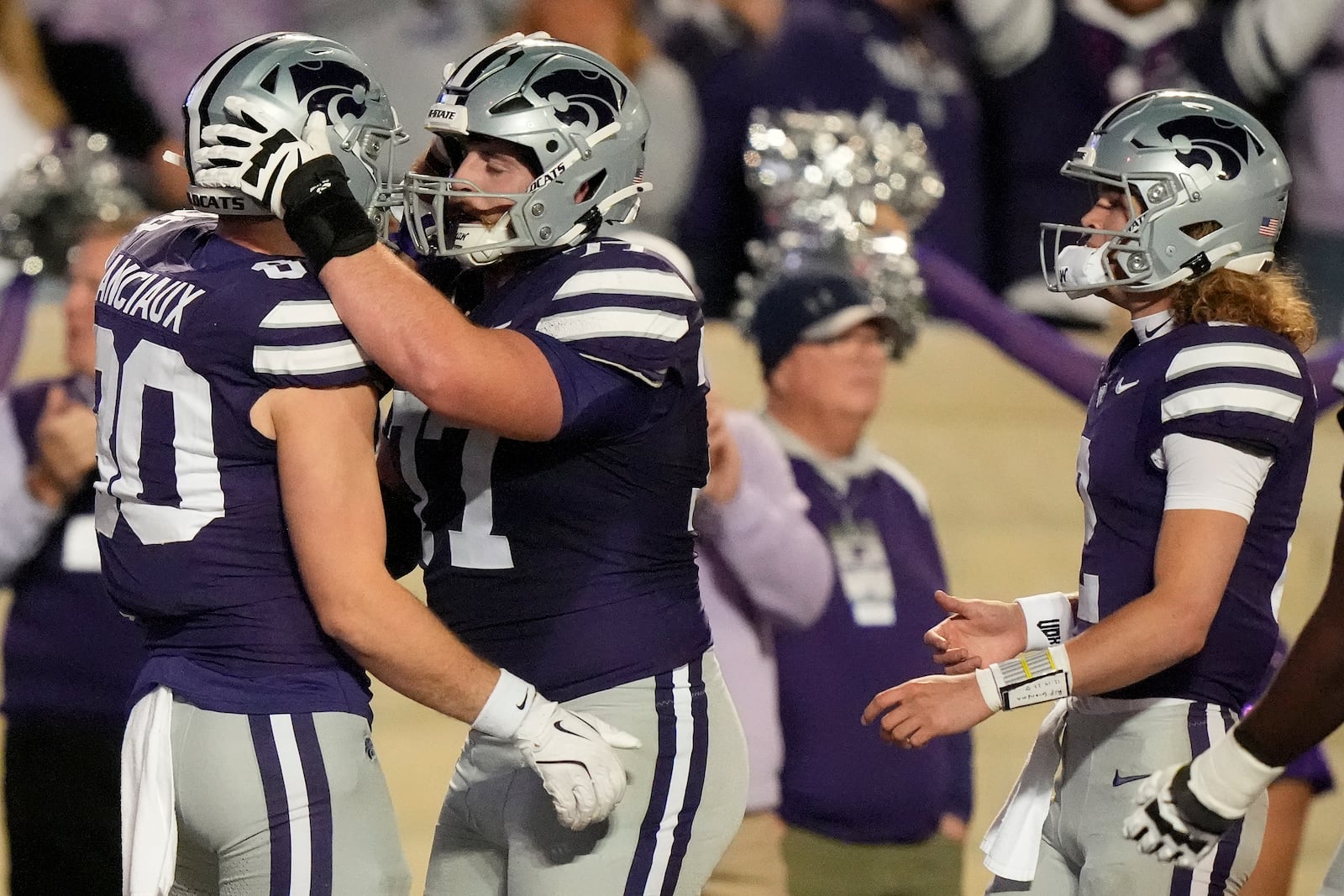 Kansas State tight end Will Anciaux (80) celebrates with offensive lineman Carver Willis after scoring a touchdown during the first half of an NCAA college football game against Kansas Saturday, Oct. 26, 2024, in Manhattan, Kan. (AP Photo/Charlie Riedel)