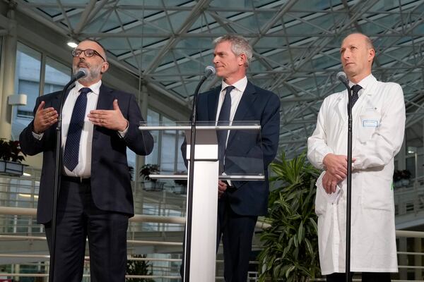 From left, head physician of Vatican's Health and Hygiene Office, Luigi Carbone, pope's spokeperson Matteo Bruni, and Surgeon Sergio Alfieri, speak to journalists, Saturday, March 22, 2025, in the entrance hall of Rome's Agostino Gemelli Polyclinic where Pope Francis has been treated for bilateral pneumonia since Feb. 14, 2025 and announce the 88-year old pope will return to The Vatican tomorrow, Sunday Feb. 23. (AP Photo/Gregorio Borgia)