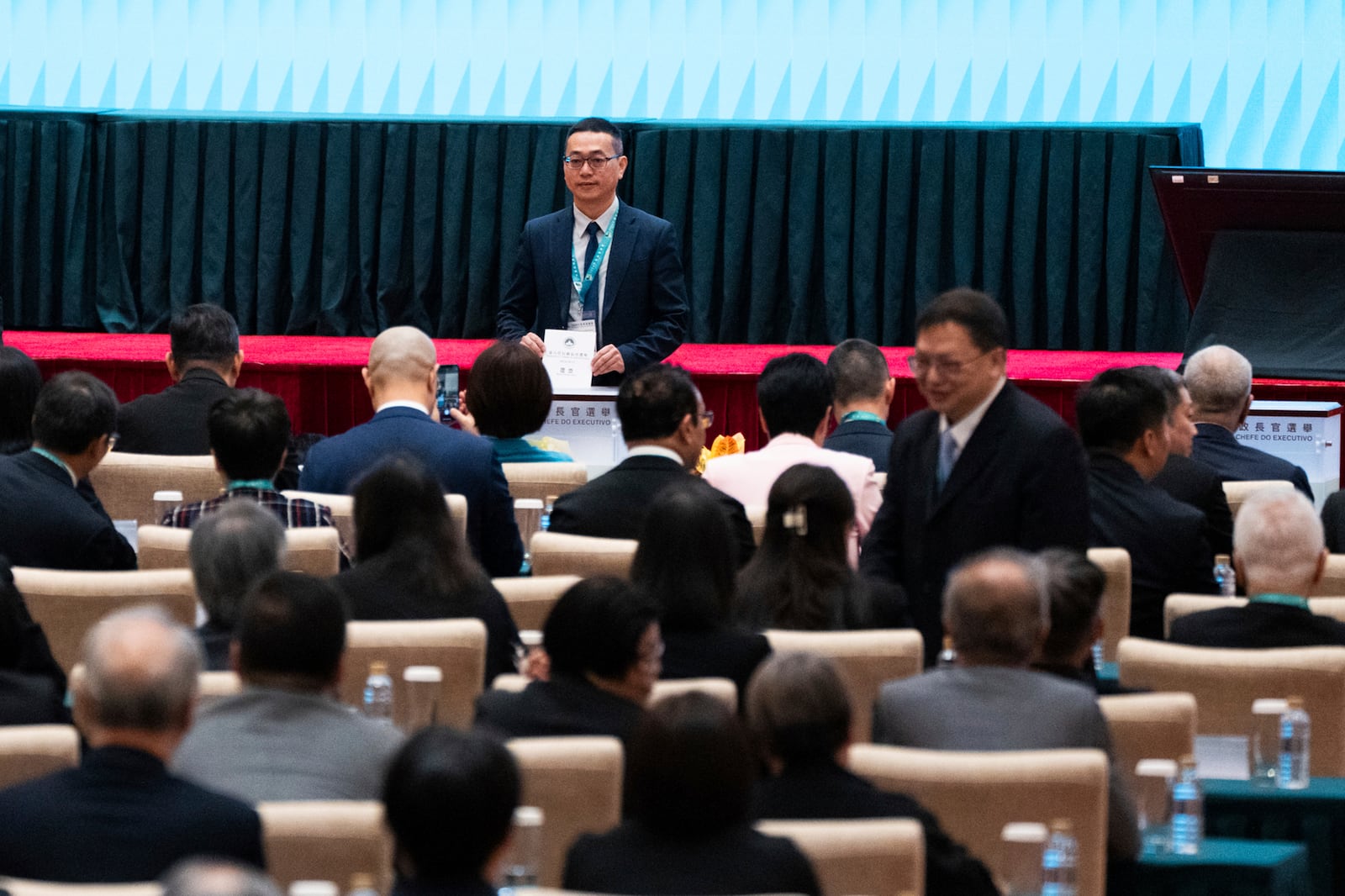 An election committee member votes during the chief executive election in Macao, Sunday, Oct. 13, 2024. (AP Photo/Bertha Wang)