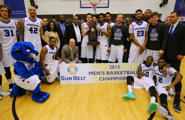 030715 ATLANTA: Georgia State gathers for a team photo on the court after winning the Sunbelt Men's Basketball Regular Season Championship beating Georgia Southern 72-55 in a basketball game on Saturday, March 7, 2015, in Atlanta. Curtis Compton / ccompton@ajc.com The GSU president says, "...our basketball players epitomized the grit that is the foundation on which Georgia State is built." Curtis Compton / ccompton@ajc.com