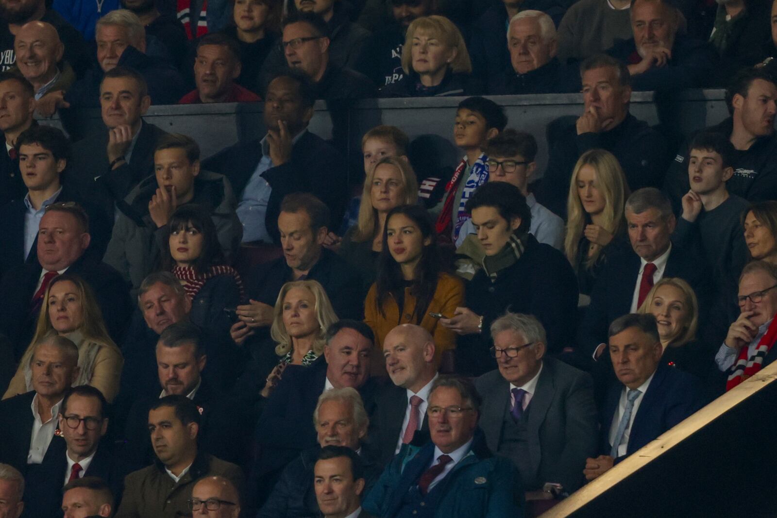 American singer-songwriter and actress Olivia Rodrigo, centre, attends the Premier League soccer match between Manchester United and Chelsea at Old Trafford stadium in Manchester, England, Sunday, Nov. 3, 2024. (AP Photo/Ian Hodgson)