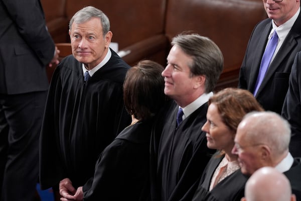 Supreme Court Chief Justice John Roberts, left, and associate justices, arrive in the House Chamber before President Donald Trump arrives to address a joint session of Congress at the Capitol in Washington, Tuesday, March 4, 2025. (AP Photo/J. Scott Applewhite)